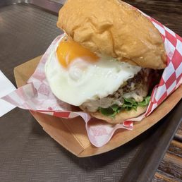 Pineapple burger with a fried egg added. Pineapple burger with a fried egg added.