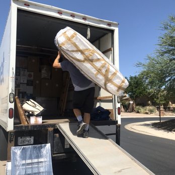 Titan Relocation Services - The crew working hard in the summer breeze. - Movers Near Me Titan Relocation Services - The crew working hard in the summer breeze. - Movers Near Me