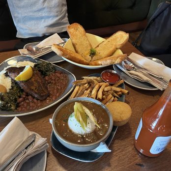 Jude's Old Town - Grits Plate (left), Gumbo (bottom), eggplant dip (top) - Cajun/Creole Near Me - Seattle, Washington Jude's Old Town - Grits Plate (left), Gumbo (bottom), eggplant dip (top) - Cajun/Creole Near Me - Seattle, Washington