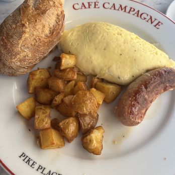 Café Campagne - Goat cheese and escarole omelette with chicken sausage, potatoes and baguette- better than it looks (delicious!) - French Near Me - Seattle, Washington Café Campagne - Goat cheese and escarole omelette with chicken sausage, potatoes and baguette- better than it looks (delicious!) - French Near Me - Seattle, Washington