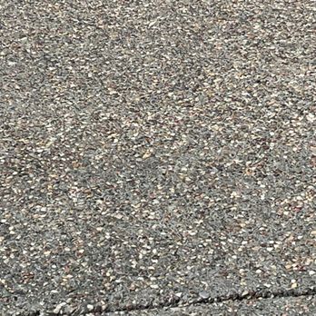 Ornelas Landscaping & Grading - Close-up of new pebble-surface concrete pad - Excavation Services Near Me - Gilroy, California Ornelas Landscaping & Grading - Close-up of new pebble-surface concrete pad - Excavation Services Near Me - Gilroy, California