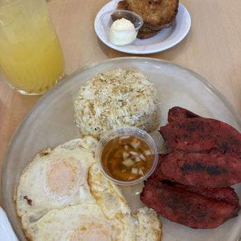 Breezy - Pork longanisa with fried rice and over easy eggs with a side of sourdough toast. Calamansi juice. - Breakfast & Brunch Near Me - San Juan Capistrano, California
