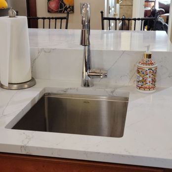 Best Buy Interior Finishes - A better view of the island waterfall and stainless under-mounted prep sink with accessories, cutting board and colander. - Carpeting Near Me - Naperville, Illinois Best Buy Interior Finishes - A better view of the island waterfall and stainless under-mounted prep sink with accessories, cutting board and colander. - Carpeting Near Me - Naperville, Illinois