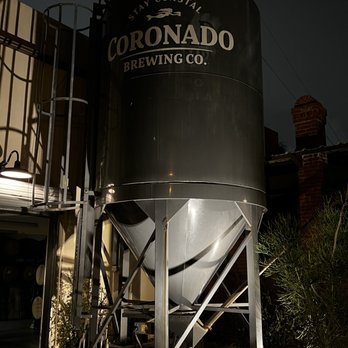Coronado Brewing - a man standing in front of a large metal tank - Brewpubs Near Me - Coronado, California Coronado Brewing - a man standing in front of a large metal tank - Brewpubs Near Me - Coronado, California