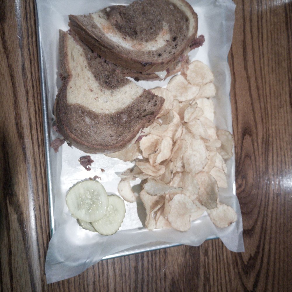 Reuben with chips and pickles