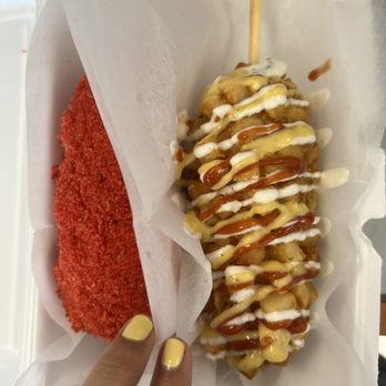 Kim Cook - a hand holding a donut covered in sauce - Korean Near Me - Montgomery, Alabama Kim Cook - a hand holding a donut covered in sauce - Korean Near Me - Montgomery, Alabama