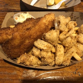 Neptune's Net - Calamari and fish basket (with slaw on a mountain of fries) - Seafood Near Me - Malibu, California Neptune's Net - Calamari and fish basket (with slaw on a mountain of fries) - Seafood Near Me - Malibu, California
