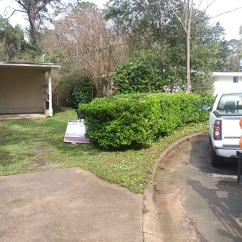 Hubbard's Lawncare - a truck parked in front of a house - Lawn Services Near Me Hubbard's Lawncare - a truck parked in front of a house - Lawn Services Near Me