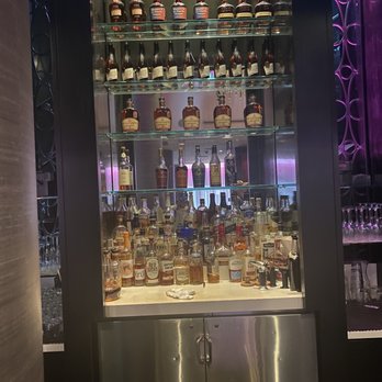 The Living Room - a display of liquor bottles - New American Near Me - Minneapolis, Minnesota