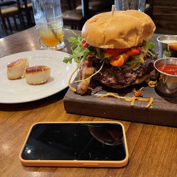 Willard Hicks - The burger, two scallops from my friend's dish, and an iPhone 13 Mini for scale. - New American Near Me - Campbell, California Willard Hicks - The burger, two scallops from my friend's dish, and an iPhone 13 Mini for scale. - New American Near Me - Campbell, California