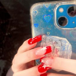 Red French tip and full nail with stars Red French tip and full nail with stars