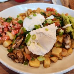 Veggie Hash $17.99 in 2025.   Two poached eggs and lots of avocado.