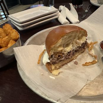 Ellyn's Tap & Grill - Burgatory- Yummy. Burger, onion tanglers with a brite tangy ranchand tots...the dynamic duo. - New American Near Me - Glen Ellyn, Illinois Ellyn's Tap & Grill - Burgatory- Yummy. Burger, onion tanglers with a brite tangy ranchand tots...the dynamic duo. - New American Near Me - Glen Ellyn, Illinois
