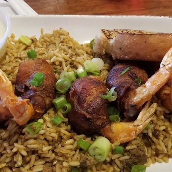 Orleans Seafood Kitchen - Bacon wrapped shrimp over rice - Cajun/Creole Near Me - Katy, Texas Orleans Seafood Kitchen - Bacon wrapped shrimp over rice - Cajun/Creole Near Me - Katy, Texas