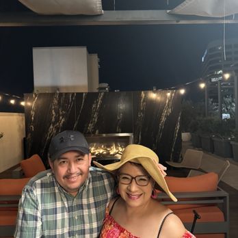 Cameo Apartments - Enjoying an evening dinner on the Cameo roof top - Apartments Near Me - Orange, California