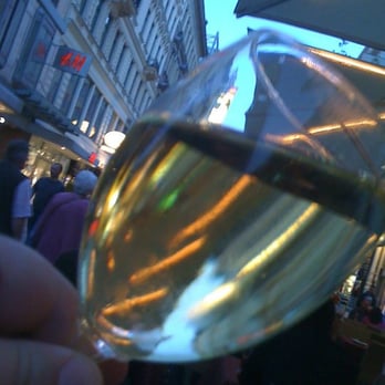 Pizzeria Venezia - Wein as seen through "Grüner Veltliner" colored classes from platz table at Venezia - Pizza Near Me - Vienna, 9 Pizzeria Venezia - Wein as seen through "Grüner Veltliner" colored classes from platz table at Venezia - Pizza Near Me - Vienna, 9
