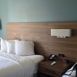 Ramada by Wyndham Coeur d'Alene - I tried to scrub these headboards. Whatever this was (shiny stuff) didn't come off