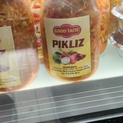 Good Taste Flatlands - Pikliz - a cabbage slaw made with carrots, hot peppers, onion, vinegar, and salt