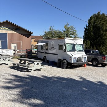 Cap’n Ron’s Fish and Chips - Food truck and picnic table seating - Fish & Chips Near Me - Munising, Michigan