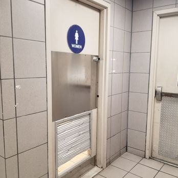 Emerald Square - Looks like someone tried to kick their way into the ladies room - Shopping Centers Near Me - North Attleborough, Massachusetts