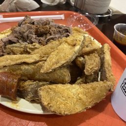 Sliced BBQ plate with choices of two sides - potato wedges and BBQ beans. Sliced BBQ plate with choices of two sides - potato wedges and BBQ beans.