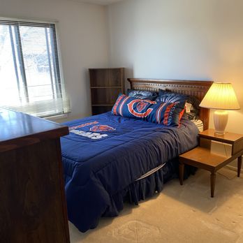 Orderly Abode - After - spare bedroom reclaimed and Bears memorabilia packed and safely stored - Home Organization Near Me Orderly Abode - After - spare bedroom reclaimed and Bears memorabilia packed and safely stored - Home Organization Near Me