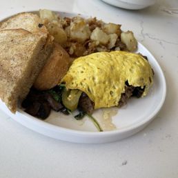 Veg omelette - vegan sausage, toast and potatoes