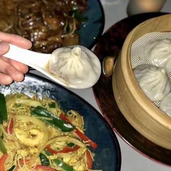 Wu Chow - Beef chow fun (top left), Singapore noodles (bottom left), soup dumplings (right). - Dim Sum Near Me - Austin, Texas