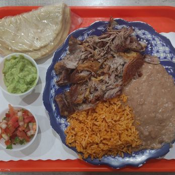 El Pollo Grill - Lemon Grove - Carnitas Plate with Mexican rice, refried beans, flour tortillas, guacamole, and salsa - Mexican Near Me - Lemon Grove, California