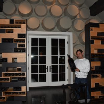 Merus Wines - a man standing in front of a wine cellar - Wine Tasting Room Near Me - Saint Helena, California