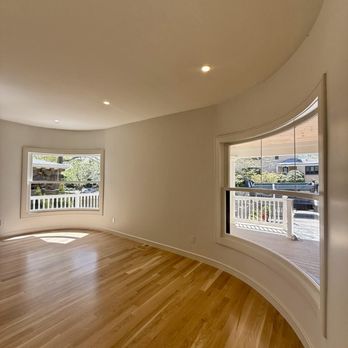 Buloke Construction Group - Brookline, MA home remodel featuring new hardwood flooring and custom curved windows. - General Contractors Near Me - Southborough, Massachusetts