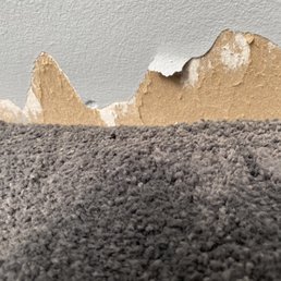 a close up of a wall with a hole in it