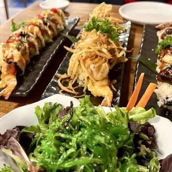 Tsukiyo Sushi - Salmon crunch roll, Bengal roll and rattlesnake roll with seaweed salad. - Sushi Bars Near Me - Westminster, California