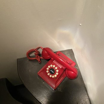 Upper West - Cool red telephone in booth - New American Near Me - Santa Monica, California Upper West - Cool red telephone in booth - New American Near Me - Santa Monica, California