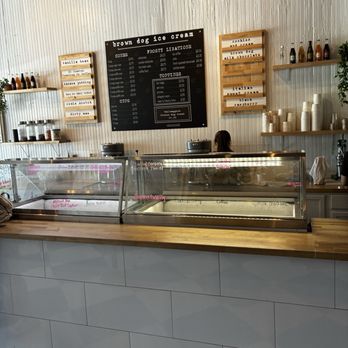 Brown Dog Ice Cream - Menu on the board and flavor options written on the glass - Ice Cream & Frozen Yogurt Near Me - Cape Charles, Virginia Brown Dog Ice Cream - Menu on the board and flavor options written on the glass - Ice Cream & Frozen Yogurt Near Me - Cape Charles, Virginia