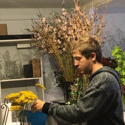 Mora's Floral Design Studio - They take care of their flowers gracefully Florist consultant seen here cleaning flowers and processing. Quick and efficiently thanks mike!!
