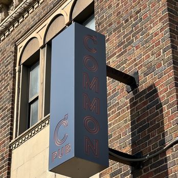 Common Pub - a sign on a brick building - Pubs Near Me - Detroit, Michigan Common Pub - a sign on a brick building - Pubs Near Me - Detroit, Michigan