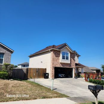 Hidalgo Roofing and Remodeling - a two story house with a garage - Roofing Near Me - Pharr, Texas