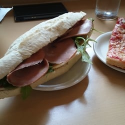 The Norfolk Street Deli - White Spanish Bread with mortadella, provolone cheese, dried tomatoes and rocket.