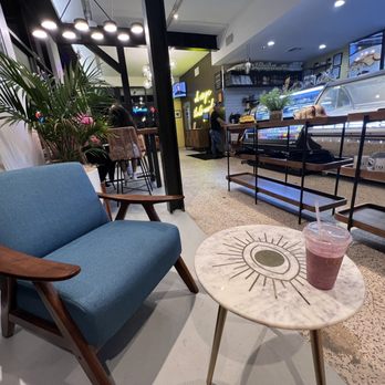 Coco Crepes & Coffee - Greenway - The evil eye table with a blue arm chair - Creperies Near Me - Houston, Texas Coco Crepes & Coffee - Greenway - The evil eye table with a blue arm chair - Creperies Near Me - Houston, Texas