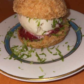 Nancy's Hustle - profiteroles stuffed with soft jasmine stracchiatella ice cream, strawberry sauce and lime - New American Near Me - Houston, Texas Nancy's Hustle - profiteroles stuffed with soft jasmine stracchiatella ice cream, strawberry sauce and lime - New American Near Me - Houston, Texas