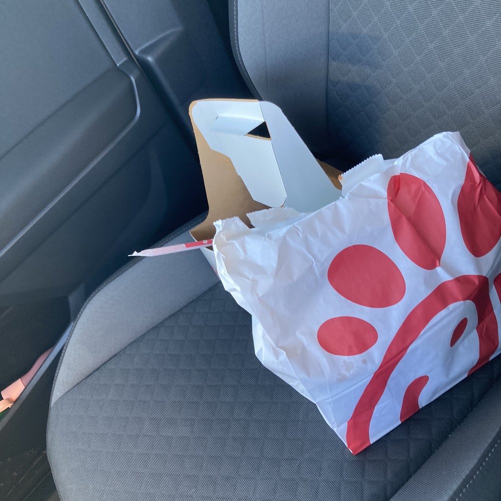 Chick-fil-A - ows a bag of food in the passenger seat of a car - Fast Food Near Me - Carson, California Chick-fil-A - ows a bag of food in the passenger seat of a car - Fast Food Near Me - Carson, California