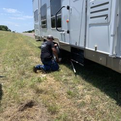 Hamrick's Automotive Center - Awesome young man fixing our tire!