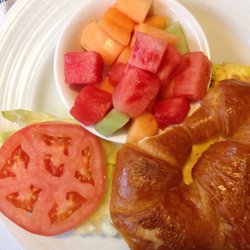 Riviera Restaurant - Breakfast croissant sandwich with fruit bowl