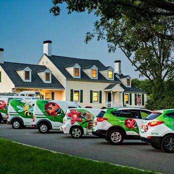 Dial Environmental - a fleet of vehicles parked in front of a house - Pest Control Near Me - East Hanover, New Jersey