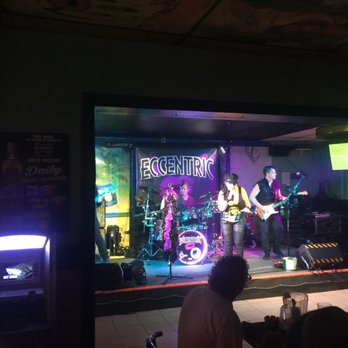 Two Buks Saloon - a band performing on stage - Sports Bars Near Me - Clearwater, Florida