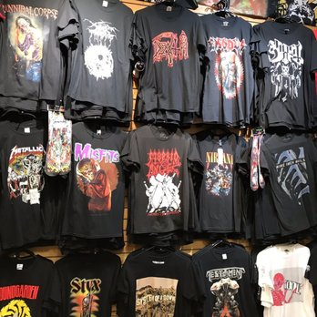 Rock Stop - Back wall of "extra premium" or rare shirts. - Men's Clothing Near Me - Sanford, Florida