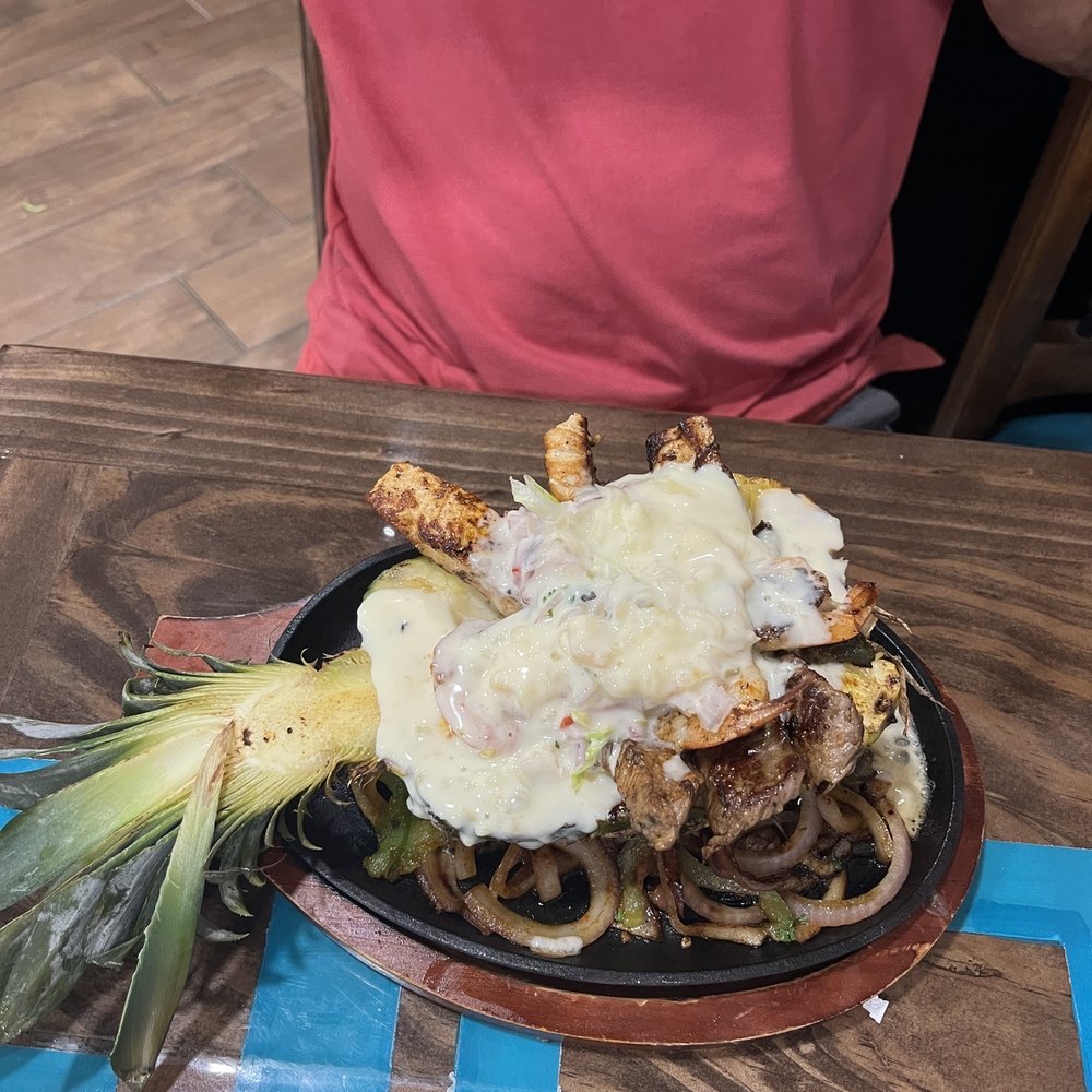 El Rincon Tacos & Grill - Pineapple fajitas with steak, chicken and shrimp with pineapple salsa - Mexican Near Me - Theodore, Alabama El Rincon Tacos & Grill - Pineapple fajitas with steak, chicken and shrimp with pineapple salsa - Mexican Near Me - Theodore, Alabama