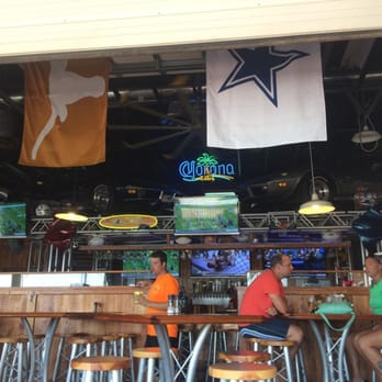 Stingrays Taphouse - (2) 1967 corvette stingrays just chilling over the bar... Seriously! - Sports Bars Near Me - Port Aransas, Texas