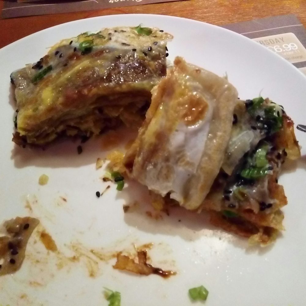 Chinese pancake with egg, sesame, spring onions, crackers and sauce... made right in front of you by the chef on request!